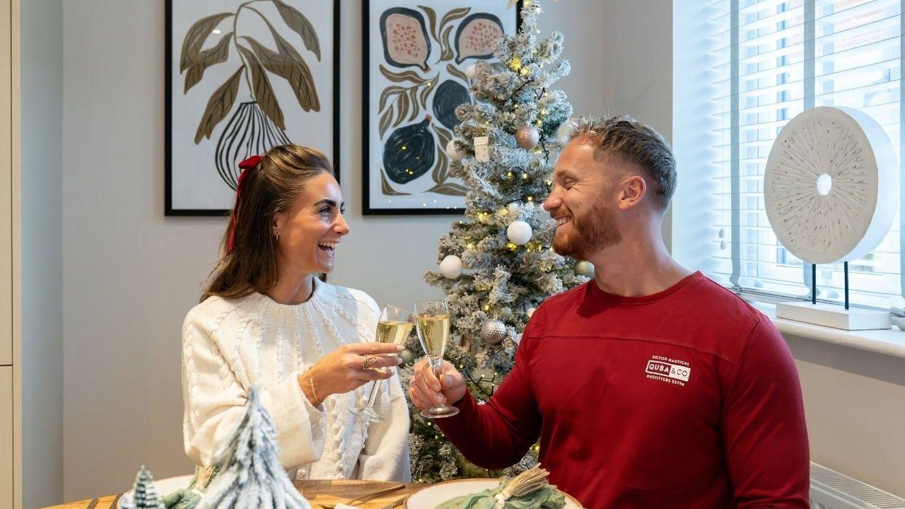 Devonshire Homes Christmas Couple Cheers At Table