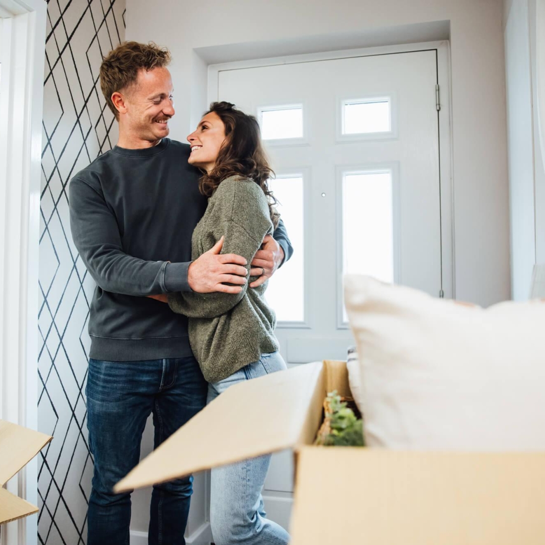 Couple Hugging In A Devonshire Home