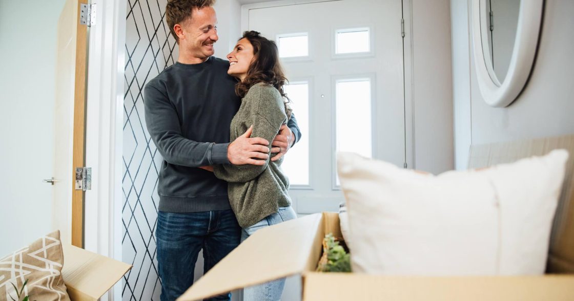 Couple Hugging In A Devonshire Home